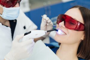 Young woman getting dental treatment.