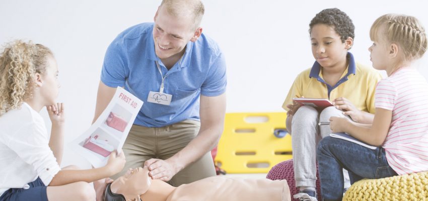 Boy with first aid instruction