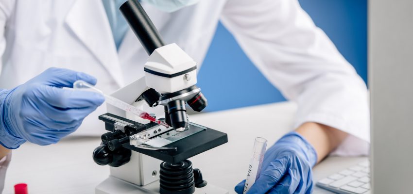 cropped view of genetic consultant doing dna test in lab