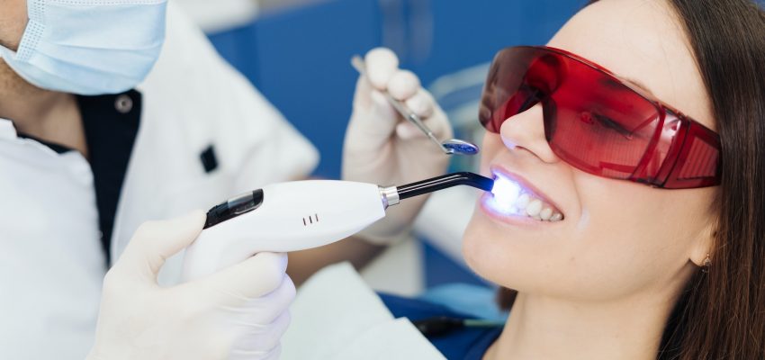Young woman getting dental treatment.