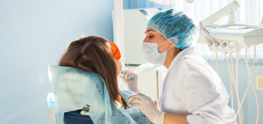 Young woman getting dental treatment. dental clinic.